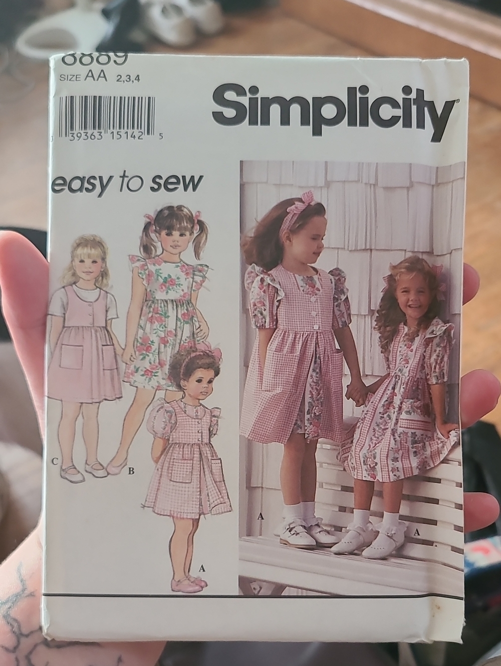 Simplicity Sewing Pattern 8889 for a toddler girls' dress and pinafore or jumper
